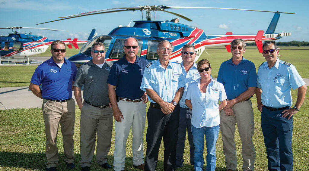 A portion of the Abbeville, Louisiana, crew. From left: Neil Collins (chief pilot), Mark Behne (BD), Bob McCoy (president), Harry Sowle (lead pilot), Dean Simpson (pilot), Amy Winch (customer service representative), Myron Hillers (director of maintenance), Jesus Colmenero (pilot).