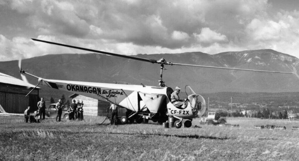 Okanagan Air Services first Bell 47B-3, CF-FZX, piloted by Carl Agar, lifts off to spray insect-infected forests in the Windermere Valley in the East Kootenays. This operation, among others in 1948, helped prove the value of helicopters. B.C. Ministry of Forests Photo