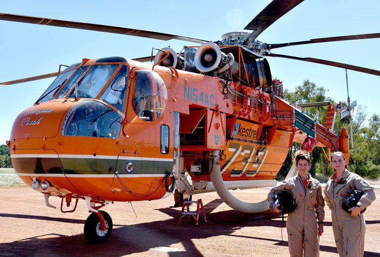 Alba Castellanos, left, and Capt Natalie Jones with an Erickson Aircrane