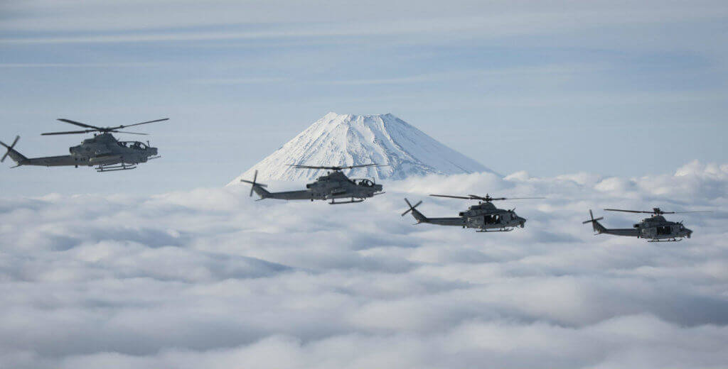 Marine Light Attack Helicopter Squadron 267's AH-1Z Viper and UH-1Y Venom helicopters fly past Mount Fuji, Shizuoka, Japan, on March 12, 2017. The squadron, currently supporting Marine Aircraft Group 36, 1st Marine Aircraft Wing, III Marine Expeditionary Force through the unit deployment program, validated the long-range capability of auxiliary fuel tanks on their H-1 platform helicopters by flying 314 nautical miles during one leg of the four-day mission on March 10.