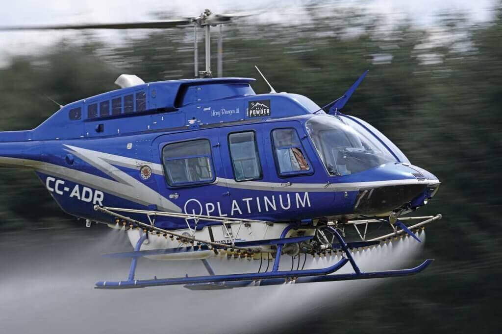 The company's Bell 207L is fitted with a Simplex spray system for agricultural spraying operations.