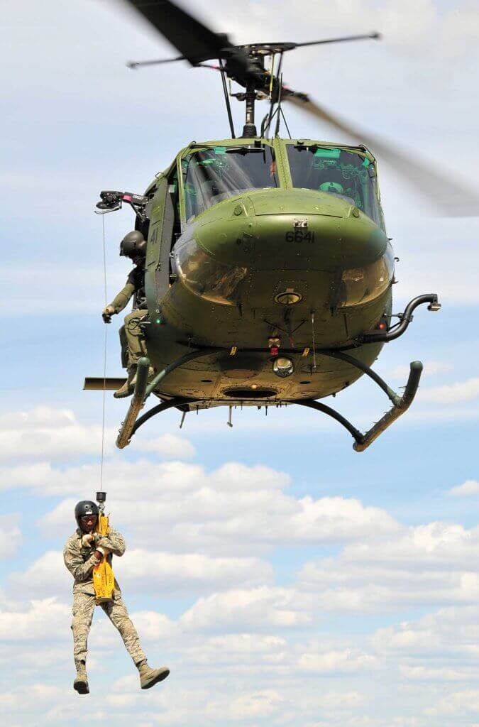 The 36th RQS Twin Hueys have internally mounted Goodrich hoists. Mountain flying