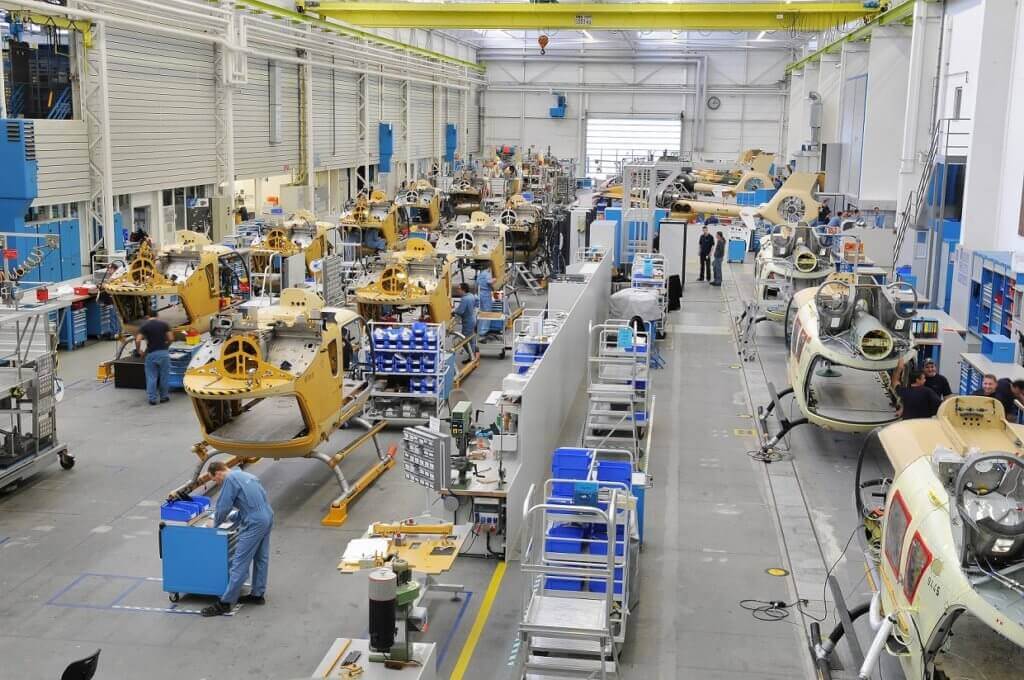 Workers navigate the H135 final assembly line in Donauworth, Germany.