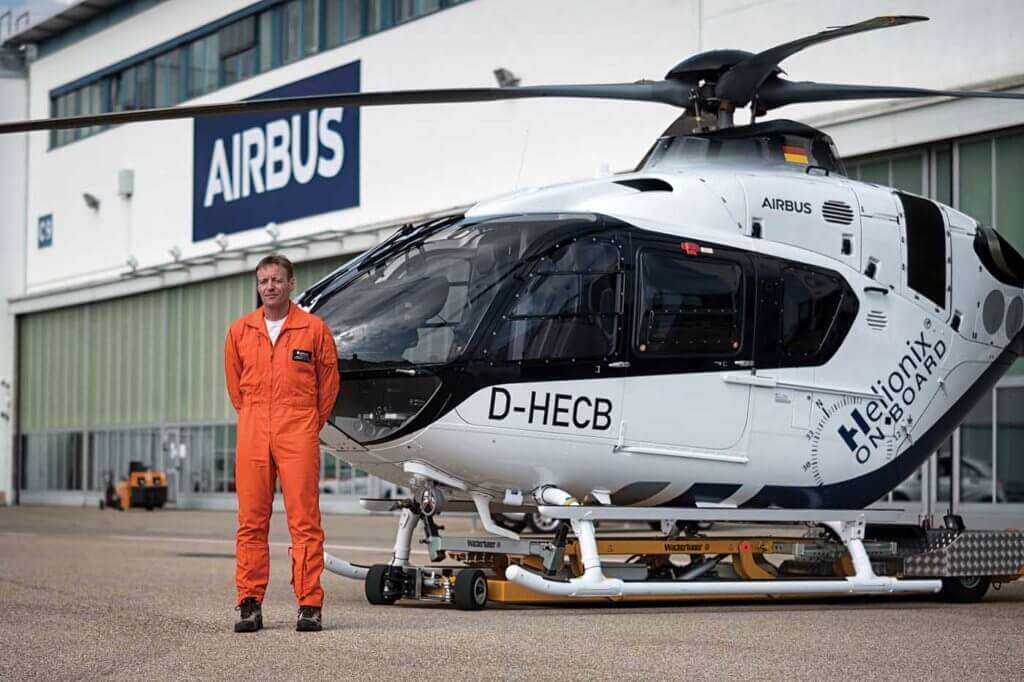 Airbus Helicopters' experimental test pilot Alexander Neuhaus stands alongside the H135 with Helionix at Airbus's facility in Donauwörth, Germany. Lloyd Horgan Photo