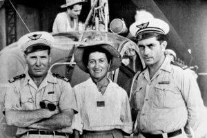 In Tan Son Hut, standing in front of a Hiller helicopter, three major players -- all pilots -- in the first helicopter medevac missions in Indochina. Left to right: Capt Alexis Santini (the first military helicopter pilot in France), Capt Valérie André and WO Henri Bartier. Philippe Boulay collection