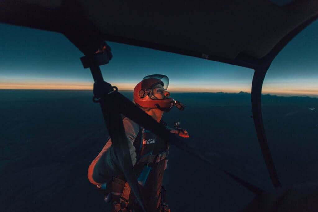 GoPro athlete Chris Farro watches the total solar eclipse from the skids of York Galland's Robinson R66, 