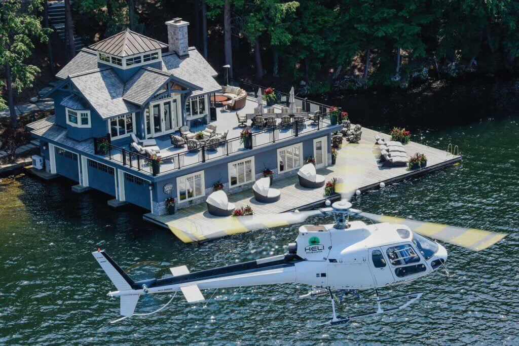 The Astar holds a hover with a spectacular boathouse in the background. Muskoka is home to some very wealthy individuals, and Heli Muskoka is carving an operational niche in supporting the construction of some of their homes.