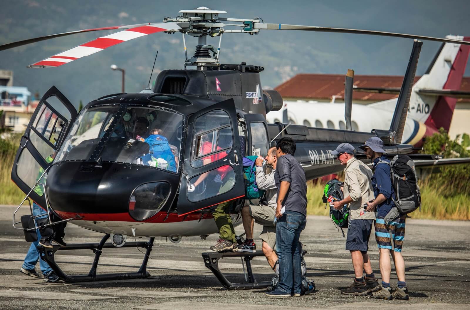 The helicopter industry in Nepal is booming thanks to a growing number of tourists, in particular high-altitude trekkers. Here, trekkers bound for Lukla board a Fishtail Air AS350 B3+ in Kathmandu in early October. Dirk Collins Photo