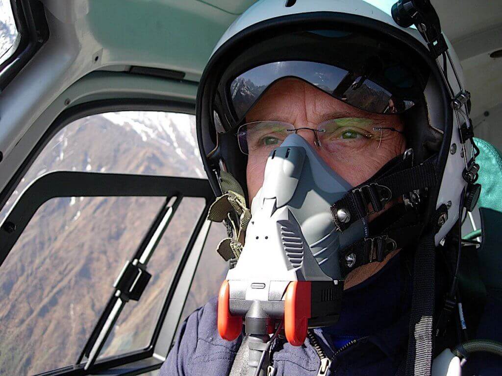 Closeup of pilot Didier Delsalle wearing oxygen mask.