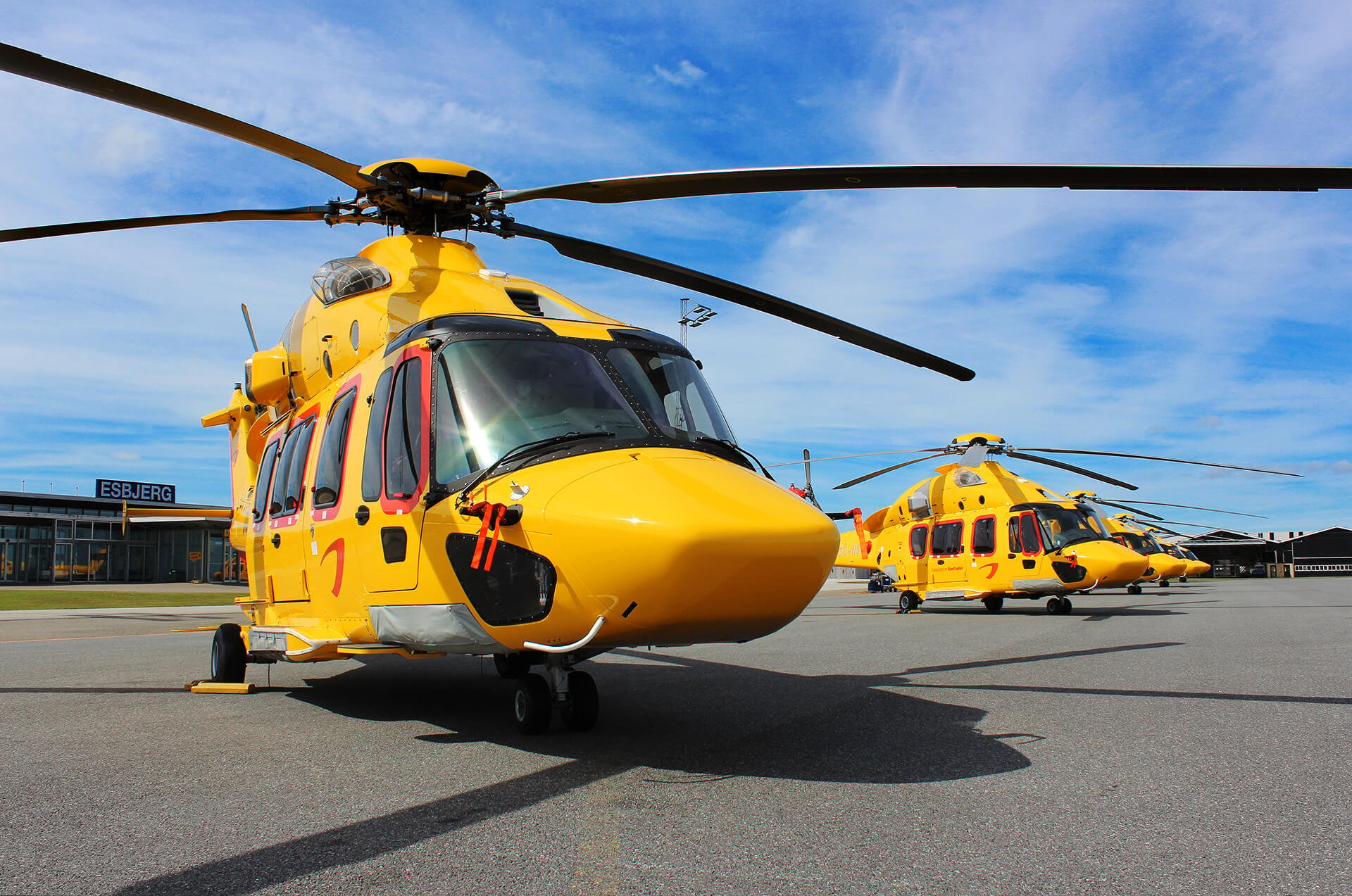 H175 helicopters rest on tarmac