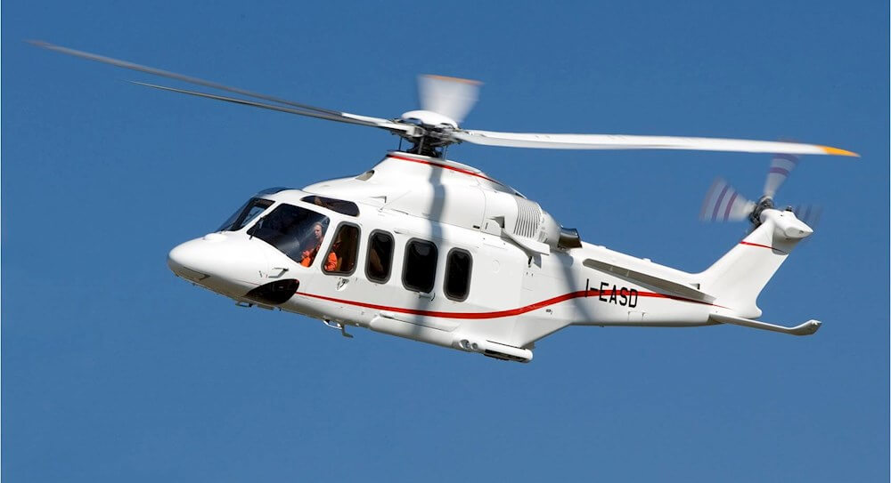 Leonardo Helicopters AW139 hovering in blue sky.
