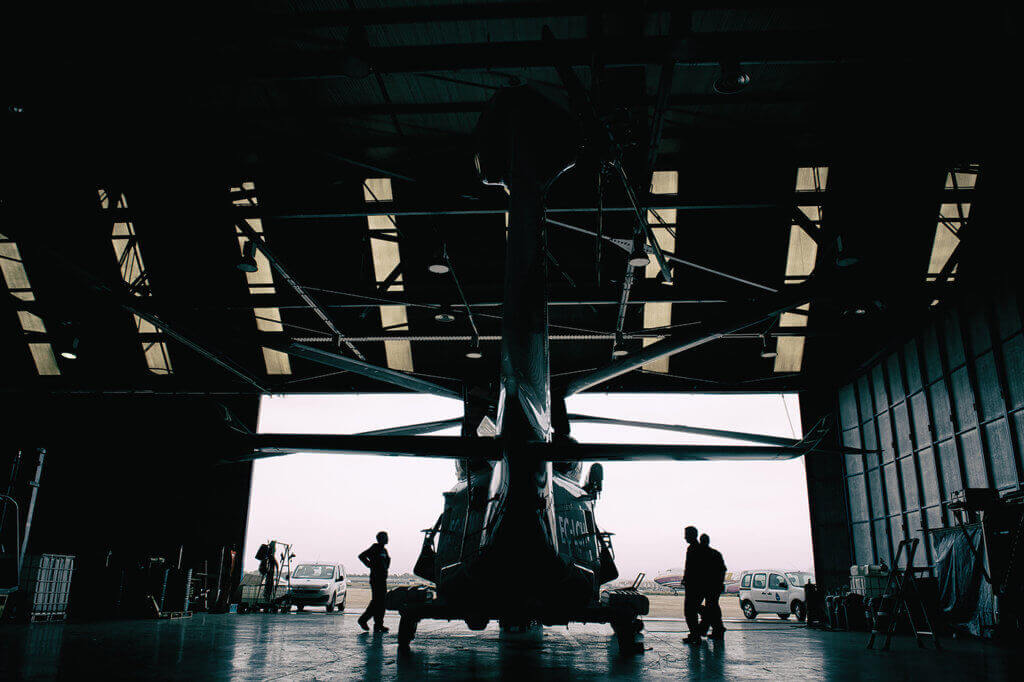  Crewmembers prepare to drag the AW139 out from the hangar for an afternoon training sortie with a civilian vessel off the coast of Valencia. Lloyd Horgan, Vortex Aeromedia Photo