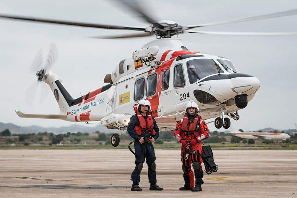 Winch operator Guillermo Penuelas and rescue swimmer Ruben Santamaria stand in front of the AW139 at their base in Valencia. Lloyd Horgan, Vortex Aeromedia Photo
