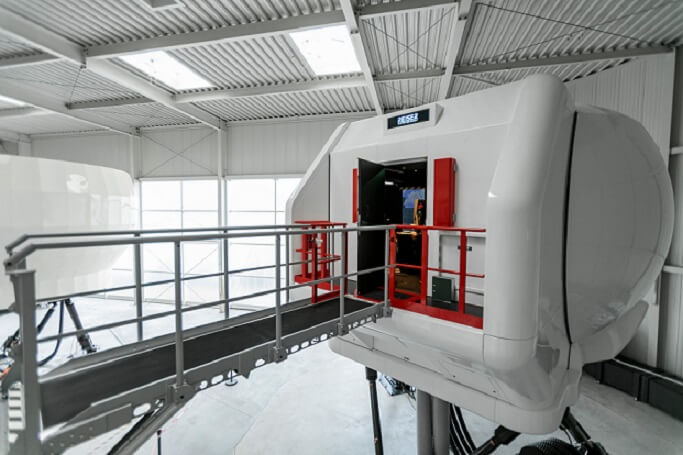 The simulator comprises a 6 DOF-electric motion and vibration system, directly projected moving imagery, and an intuitive on board instructor operating station. Christoph Papsch Photo