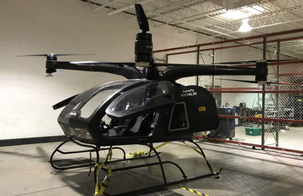 SureFly is the first electric hybrid helicopter, and it is able to carry two passengers with a range of approximately 70 miles. Workhorse Group Photo