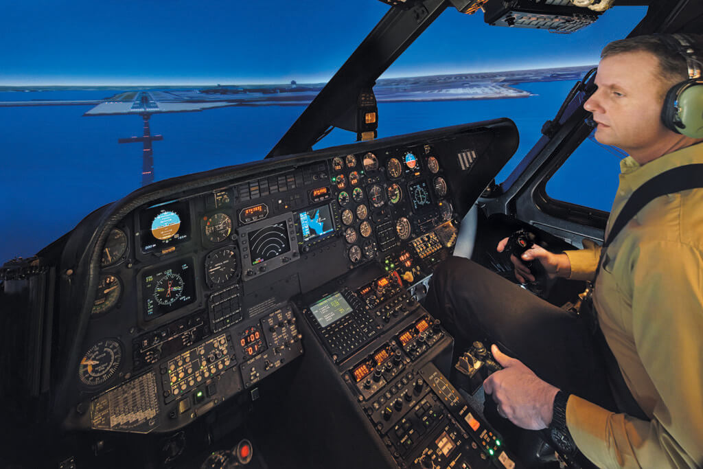 Students practice with instruction inside a FlightSafety Sikorsky S-76B Flight Simulator. FlightSafety Photo