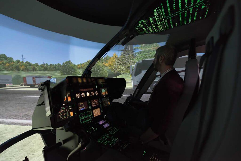 The author during a demonstration of a HEMS training sortie in the EC135 simulator. Lloyd Horgan Photo