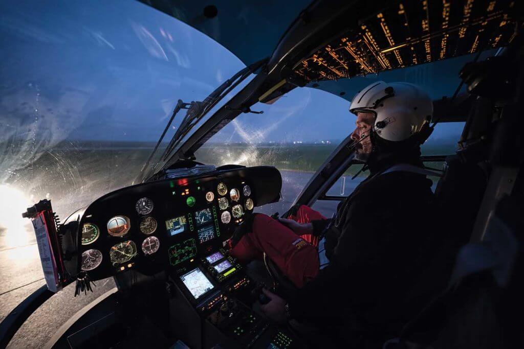 Pilot and base manager Michael Schneider sits in the cockpit of an EC135 at the Aachen rescue station. Lloyd Horgan Photo