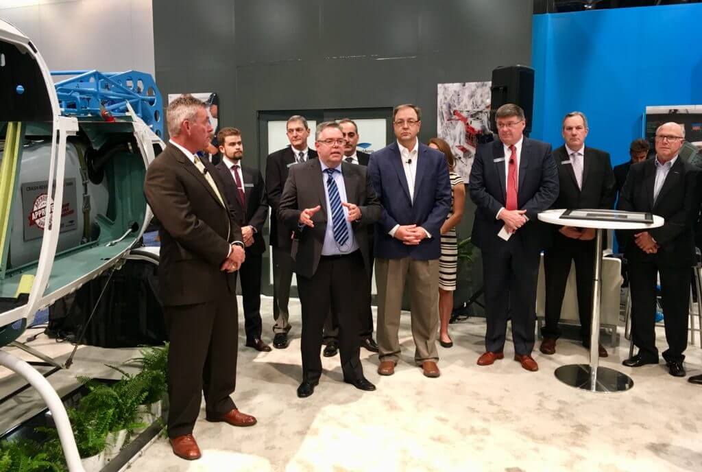 Ceremony at StandardAero booth at Heli-Expo
