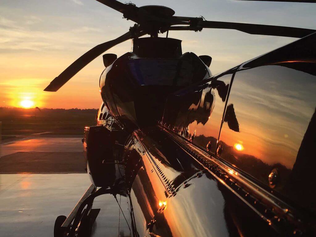 An Airbus AS355 TwinStar sits on the ramp as the sun sets. The ebb and flow of demand for vertical flight drives the international helicopter brokerage industry. Airbus Helicopters Photo