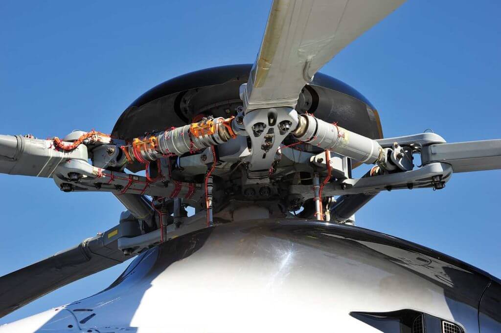 Orange cabling installed on F-WWPL's Spheriflex rotorhead gathers in-flight data from an array of strain gauges, accelerometers and other measurement sensors. Mike Reyno Photo 