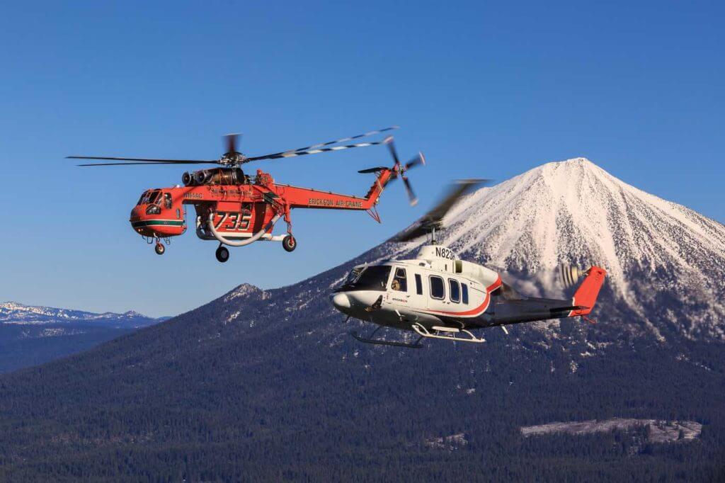 An S-64 Aircrane and Bell 214ST hold a hover in front of Mount McLoughlin near Medford, Oregon. Heath Moffatt Photo