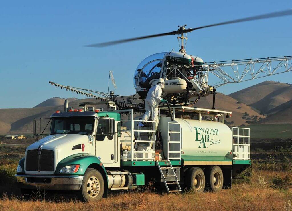 Landing on top of the work truck is routine, allowing workers to load and fuel the helicopter. Skip Robinson Photo