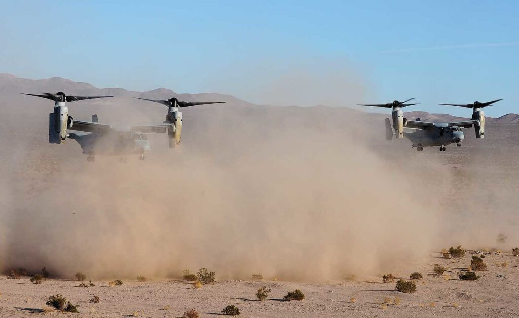 Two MV-22Bs practice a TRAP mission in the California desert. This is a constrained combat rescue of downed aircrews. Skip Robinson Photo
