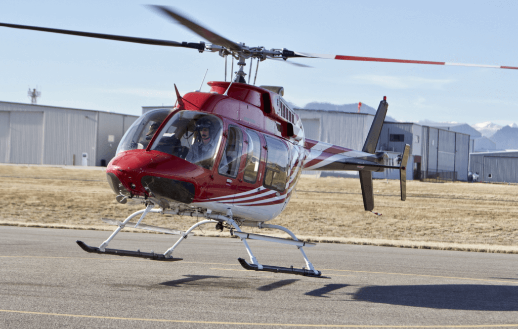 An Aero Tech Bell 407 helicopter lifts off the ground