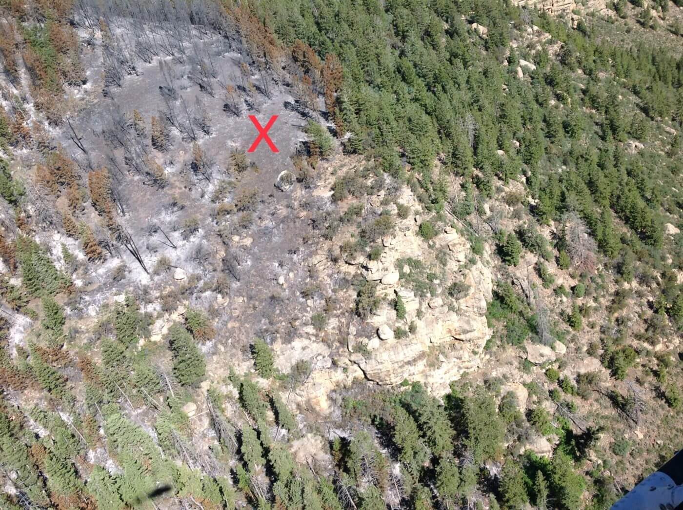 The rugged mountainous terrain from which the firefighter was evacuated