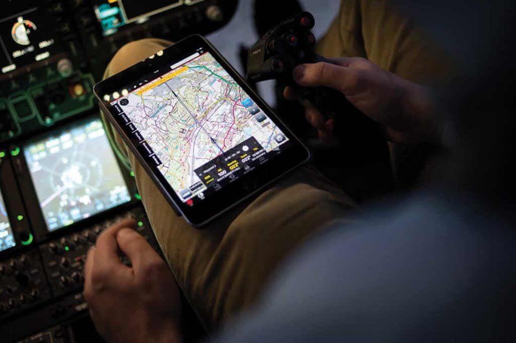 The author demos the Airbox app on an Apple iPad while in an Airbus H145 simulator. Lloyd Horgan Photo