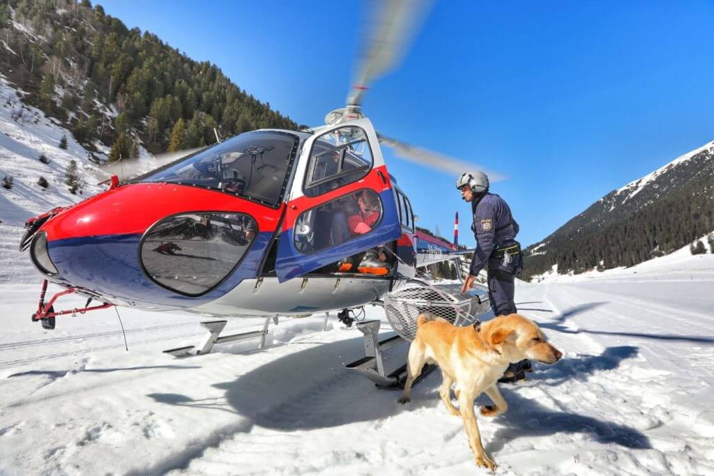 Scrambled to every avalanche accident, Austrian police helicopters play an important role in search-and-rescue activities, including shuttling mountain rescue dogs to the scene. Tomas Kika Photo