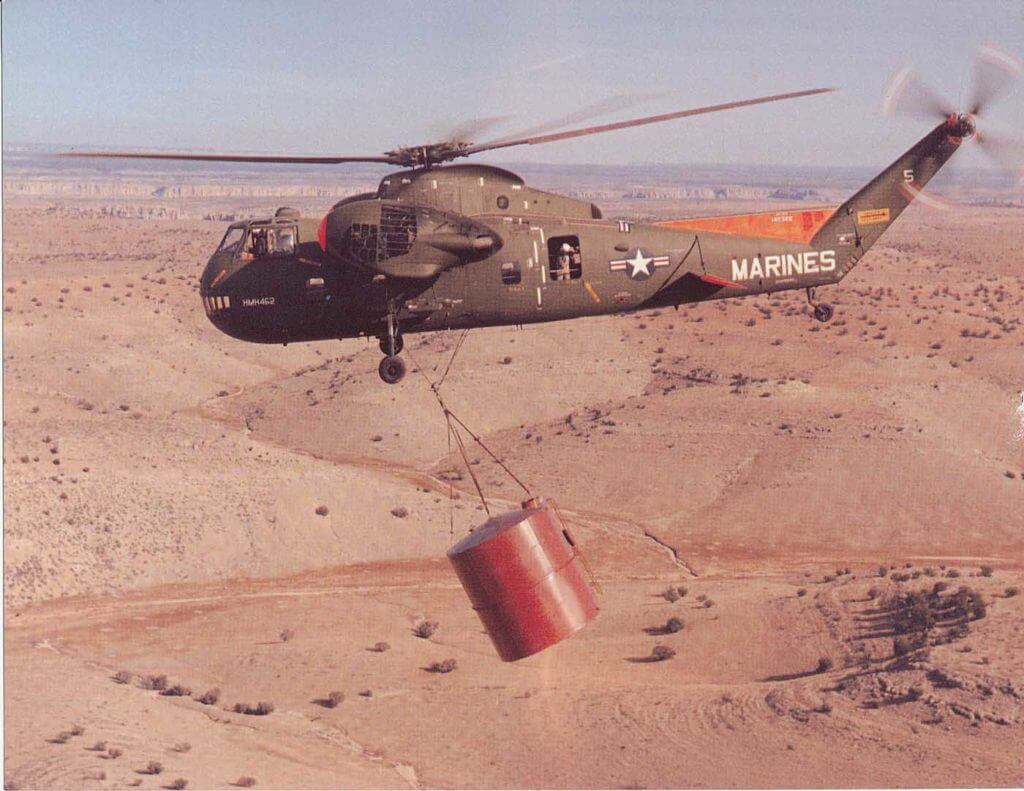 A U.S. Marine HR2S-1 Deuce helicopter slinging a tank over the desert. The helicopter was capable of lifting up to 10,000 pounds. Jeff Evans Collection Photo 
