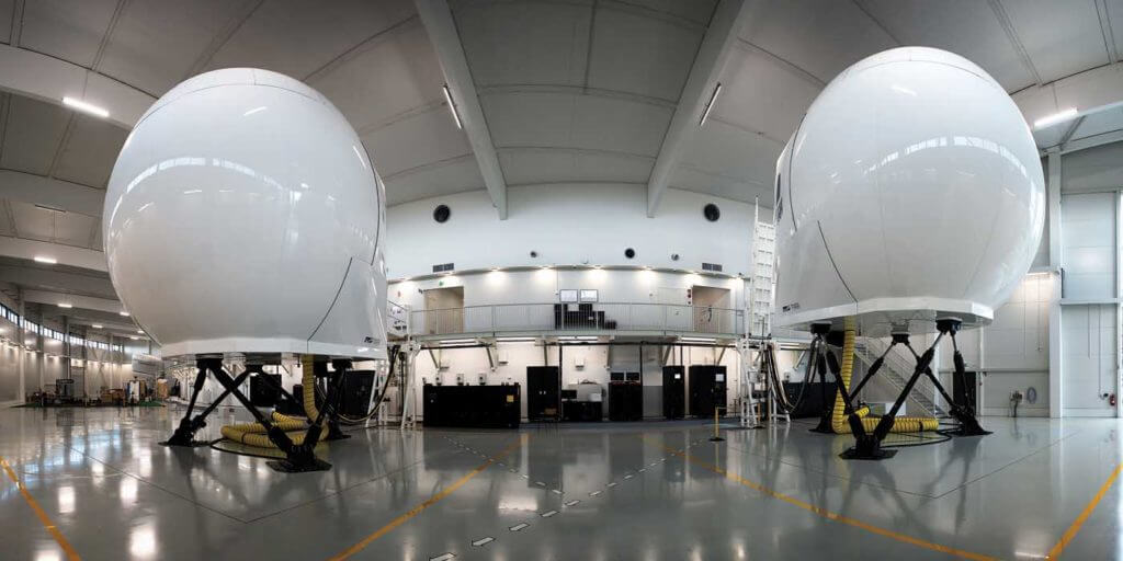 The H145 (right) and AW139 (left) simulators at Coptersafety's facility. The H125 assembly is visible in the background, and there is room for another two modules. Lloyd Horgan Photo