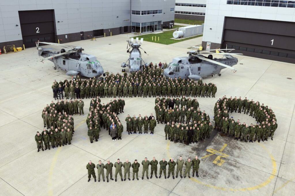 12 Wing Shearwater personnel gathered for a photo to commemorate the CH-124 Sea King helicopter's 50th anniversary. The photo was taken on the flight line in front of 423 Maritime Helicopter and 12 Air Maintenance Squadrons. Cpl Nedia Coutinho, 12 Imaging Services, Shearwater, N.S.