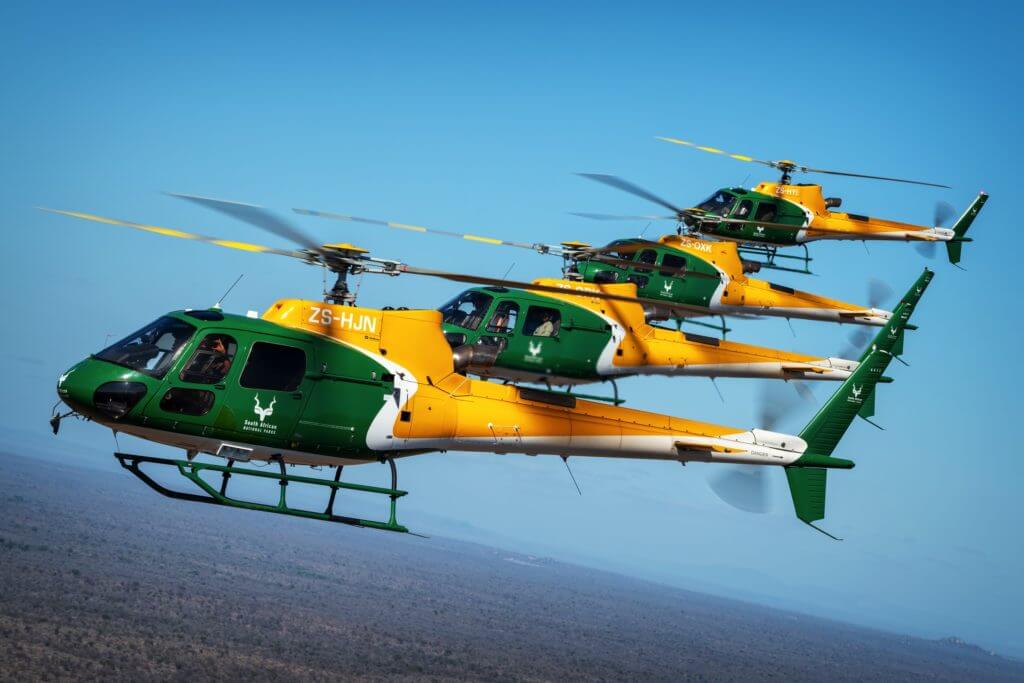 Four SANParks helicopters in formation