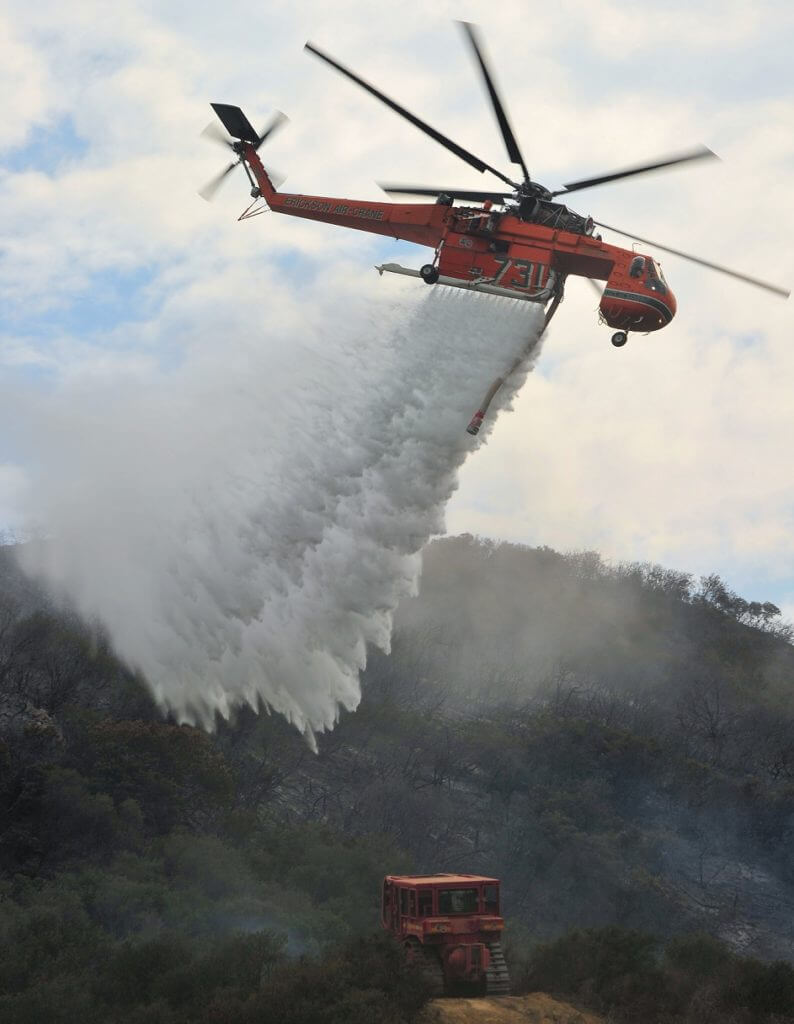 An Erickson Aircrane crashed while refilling its water tank from a dam while working on the Thomson Complex Catchment fires near Jericho, Australia. Skip Robinson Photo