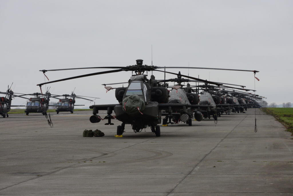 U.S. Army AH-64 Apache and UH-60 Black Hawk helicopters from the 1st Combat Aviation Brigade