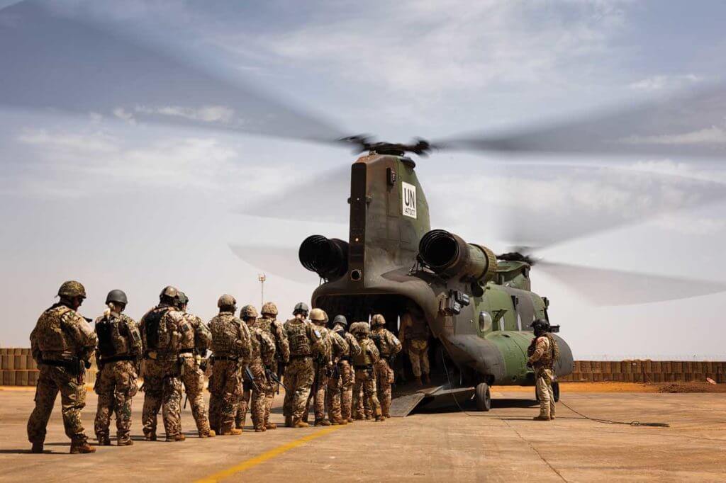 Troops prepare to board a CH-147F Chinook for a tactical airlift mission. Lloyd Horgan Photo