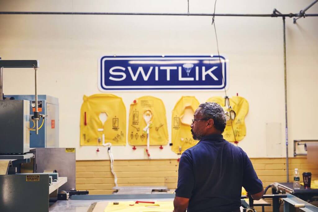 A Switlik employee supervises life vest sealing. Once produced, life vests are inflated and left overnight to ensure the pressure has not changed. Switlik Photo 