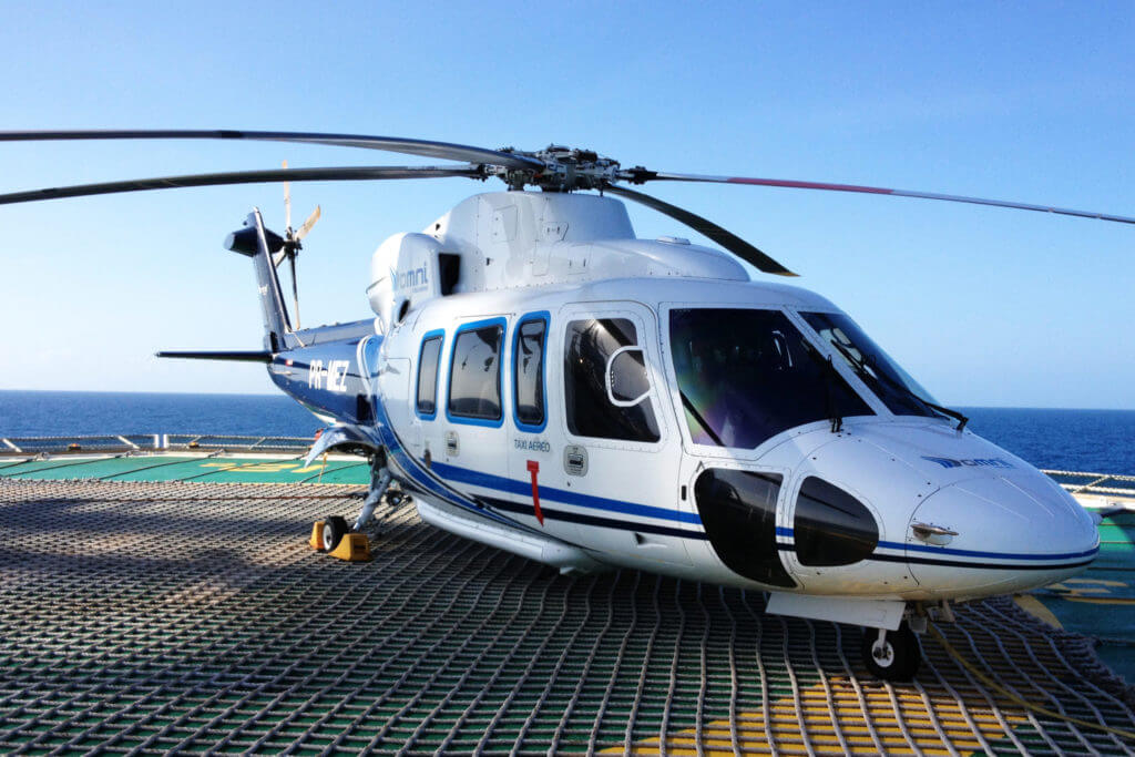 A Sikorsky S-76C, operated by Omni Taxi Aero, takes a rest at an offshore facility. Omni Taxi Aero Photo